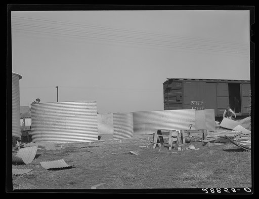 Erecting bins for corn storage under ever-normal granary plan. Marshall County, Iowa