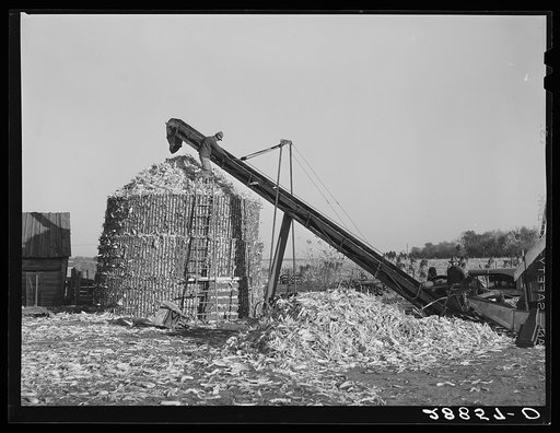 Temporary corn crib erected to store the overflowing harvest. Grundy County, Iowa