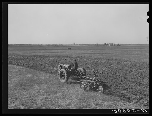 Large scale farming with tractors means greater profits on the Bois d'Arc cooperative. Osage Farms, Missouri