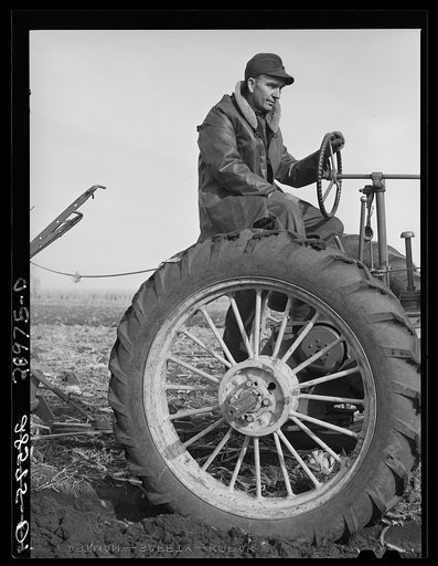 Untitled photo, possibly related to: Fred Wilfang, rehabilitation client, uses modern tractor bought with FSA (Farm Security Administration) loan. Black Hawk County, Iowa