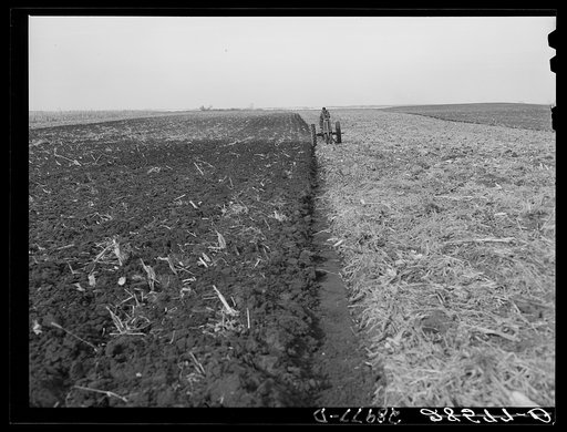 Fred Wilfang, rehabilitation client, uses modern tractor bought with FSA (Farm Security Administration) loan. Black Hawk County, Iowa