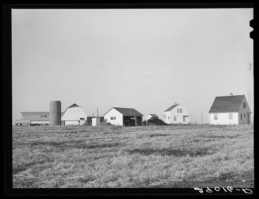 Several of the homes at the Bois d'Arc Cooperative farm are located near the dairy farms. While all of the farm is worked cooperatively each home has its own garden plot. Osage Farms, Missouri