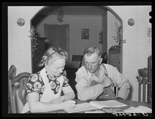 Mr. and Mrs. Fred Maschman going over their record book discuss ways of making their new farm, purchased with FSA (Farm Security Administration) aid, more profitable. Iowa County, Iowa
