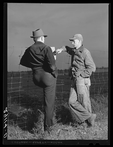 John G. Dixon, rehabilitation client, discusses farm plans with FSA (Farm Security Administration) supervisor. Saint Charles County, Missouri