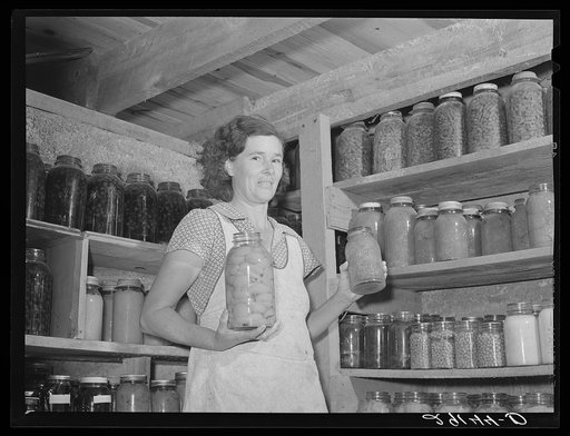 Mrs. Lawrence Corda, wife of tiff miner, with some of her 800 quarts of food canned under supervision of FSA (Farm Security Administration). Washington County, Missouri