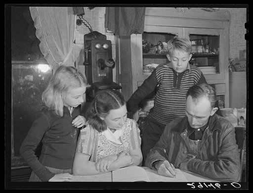 The Dixon family plan their farm program. Since becoming rehabilitation clients they have changed from wheat farming to livestock raising. Saint Charles County, Missouri