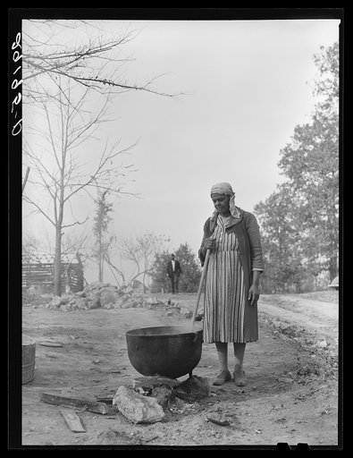 Wife of evicted sharecropper washing clothes. Butler County, Missouri