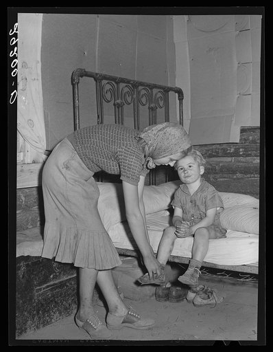 Son of evicted sharecropper is undressed for bed. Butler County, Missouri
