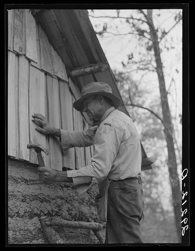 Evicted sharecropper building a cabin. Butler County, Missouri