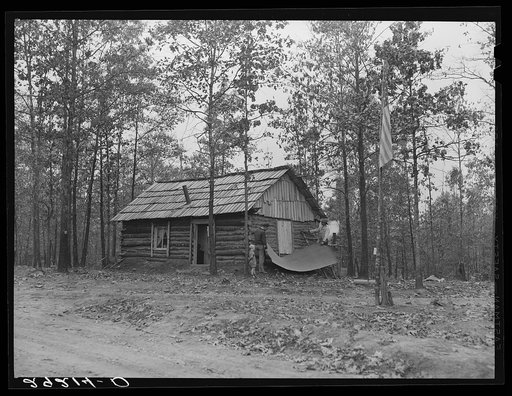 Evicted sharecroppers building a cabin. Butler County, Missouri