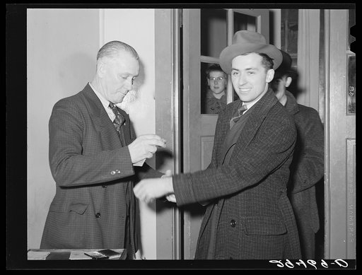 Untitled photo, possibly related to: Dancers are marked with rubber stamp as they enter the hall. Marshalltown, Iowa