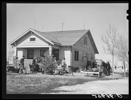 Furniture to be auctioned is displayed around P.C. Zimmerman's house near Hastings, Nebraska
