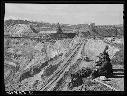 Untitled photo, possibly related to: Workers sitting at edge of copper pit. Ruth, Nevada