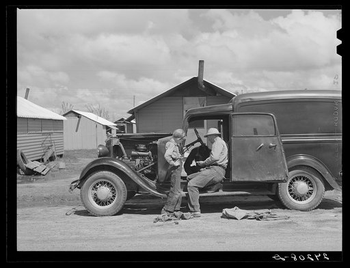 Repairing car. Tulare migrant camp. Visalia, California