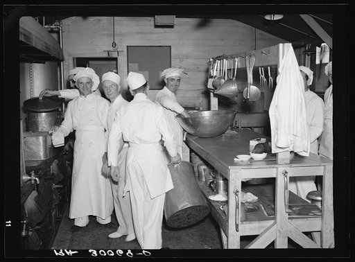 Untitled photo, possibly related to: Chefs and helpers in the camp kitchen. Allegan Project, Michigan