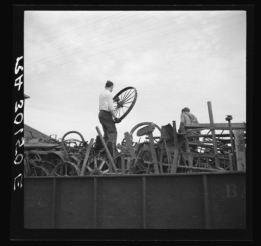 Loading scrap iron onto railroad cars. Millville, Wisconsin