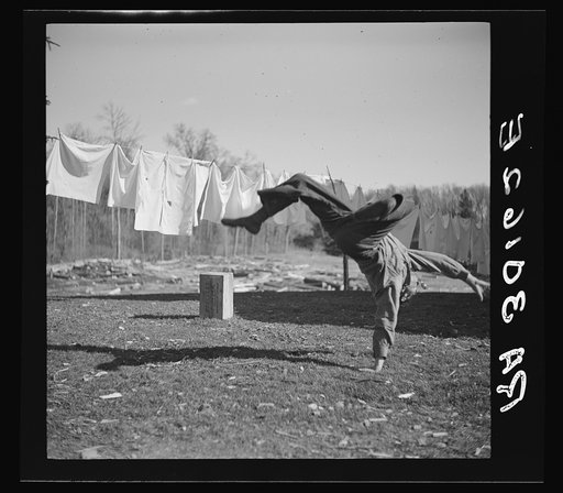 Lumberjack turning handspring near Littlefork, Minnesota
