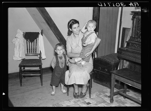 Mrs. Ray Allen and two of her children in their home near Black River Falls, Wisconsin
