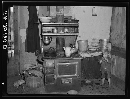 Child of Earl Taylor in the kitchen of their home near Black River Falls, Wisconsin