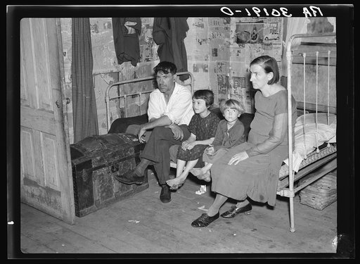 John Mathews, wife, and two children in their home near Black River Falls, Wisconsin