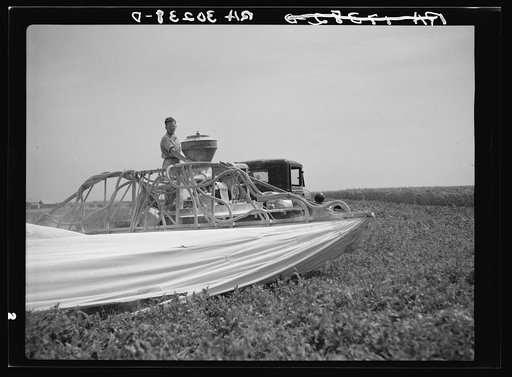 Apparatus used for spraying pea vines to eliminate lice near Sun Prairie, Wisconsin