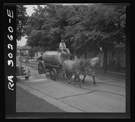 Untitled photo, possibly related to: Water wagon. New Glarus, Wisconsin