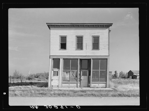 Abandoned store building and old sidewalk on what was the main street. Gemmel, Minnesota