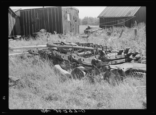 Old sled runners in abandoned lumber camp near Gemmel, Minnesota