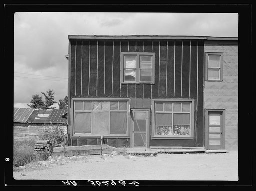 Tarpaper store, now used for living quarters. Gheen, Minnesota. Note roofing used as siding on adjoining store