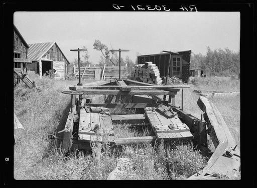 Old sled for transporting logs from forests at abandoned lumbercamp near Gemmel, Minnesota