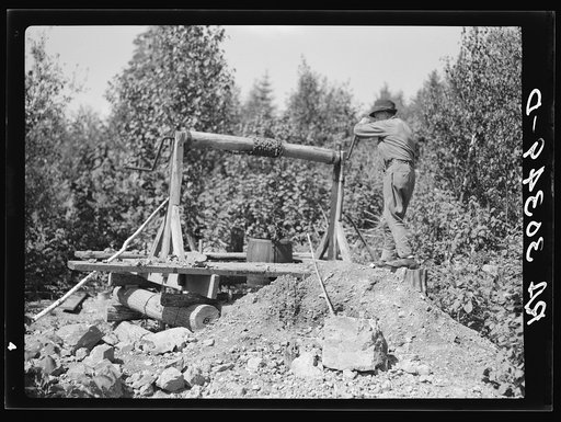 Old miner with his homemade windlass near Winton, Minnesota