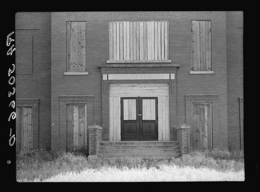 Entrance to consolidated school, now boarded up. Gemmel, Minnesota