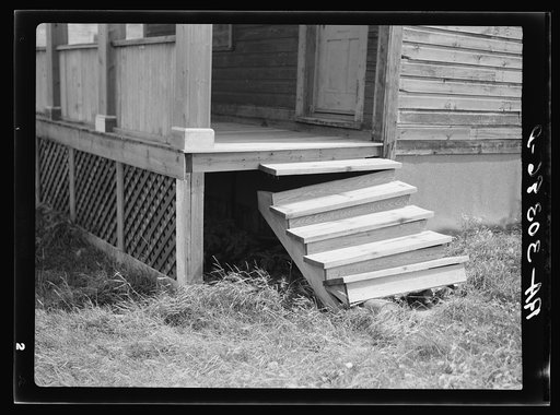Broken-down steps, entrance to abandoned house. Winton, Minnesota