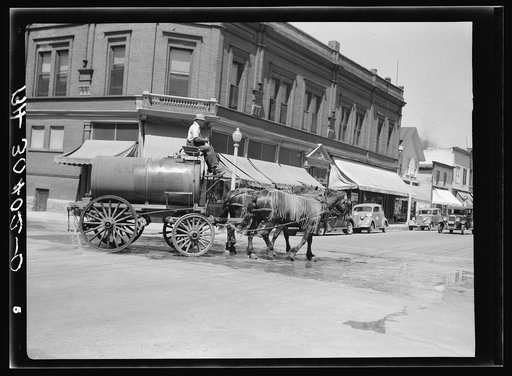 Sprinkling wagon. Western Wisconsin city