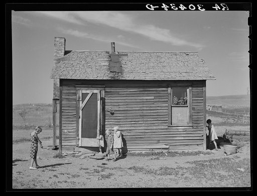 Children of Olaf Fugelberg playing in front of their home. Williams County, North Dakota
