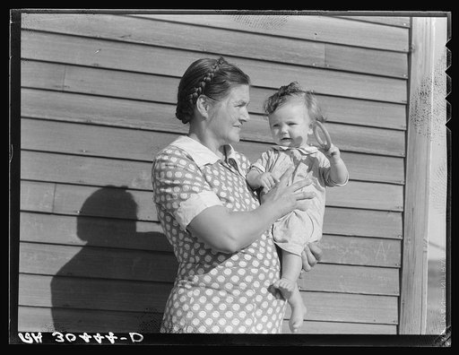 Mother and child on farm. Williams County, North Dakota