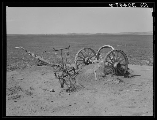 Discovered farm machinery half-buried in drifting dust. Williams County, North Dakota