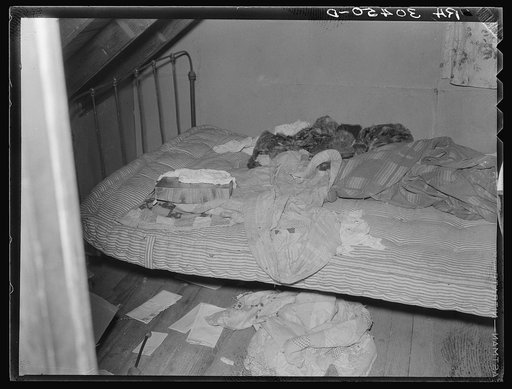 Corner of attic bedroom in farmhouse. Williams County, North Dakota