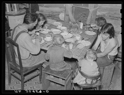William Horavitch family eating dinner. Williams County, North Dakota