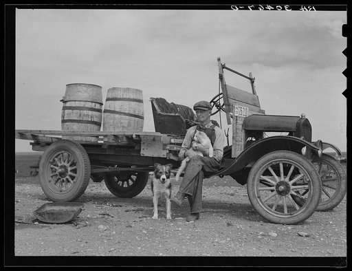 Herman Gerling. Barrels on truck are for hauling water. Near Wheelock, North Dakota