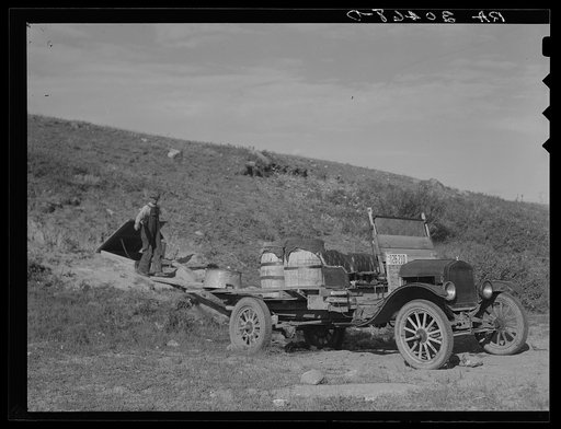 Herman Gerling carrying water from the spring. Near Wheelock, North Dakota