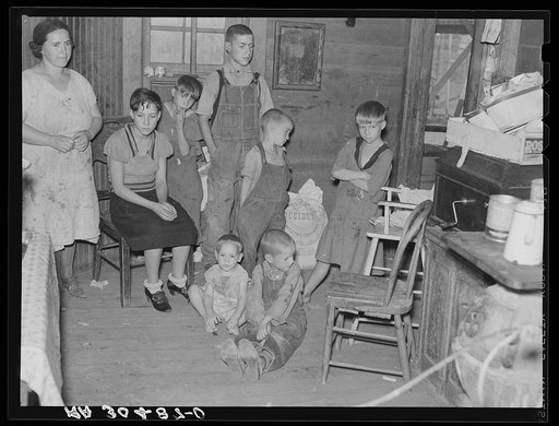 Family of Frank Peaches in their living room farm near Williston, North Dakota