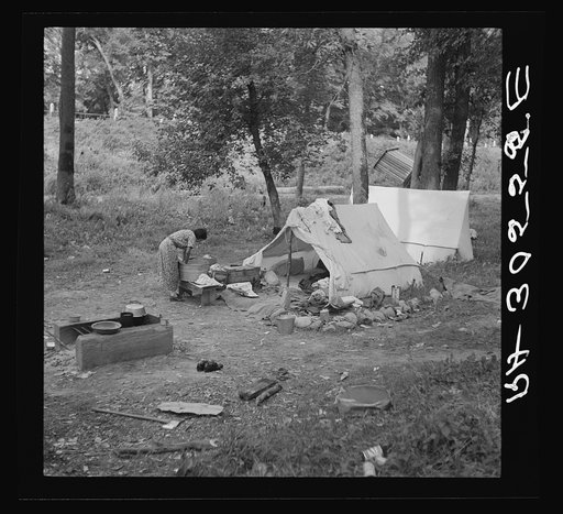 Indian woman washing clothes. Blueberry camp, Littlefork, Minnesota