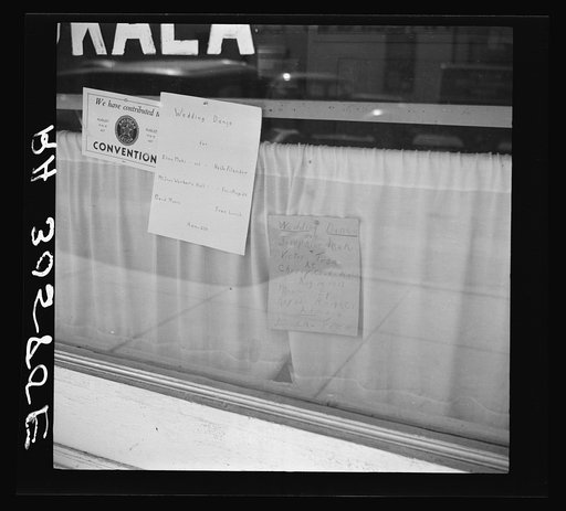 Signs in store window. Virginia, Minnesota