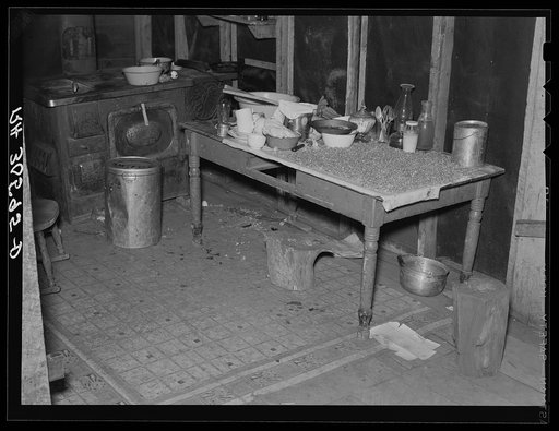 Corner of beet worker's home. Note corn drying on the table. Chaska, Minnesota