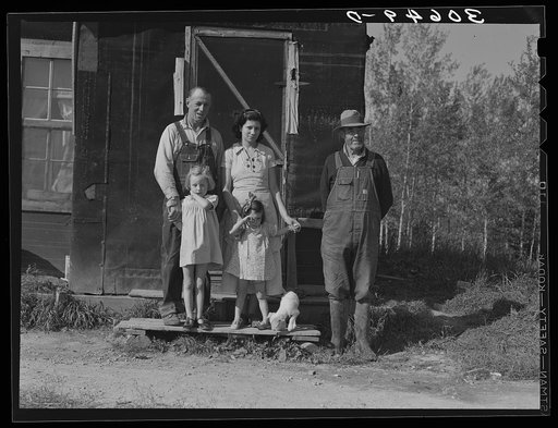 Orville White, his wife, children and father. Mr. White is a farmer of the cut-over lands near Northome, Minnesota