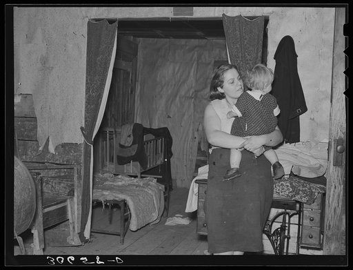 Mother and baby in cut-over farm home near Northome, Minnesota