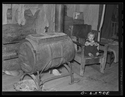 Homemade stove in farmhouse on cut-over land near Northome, Minnesota