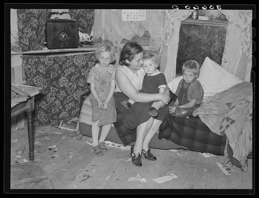 Mother and children on cut-over farm land near Northome, Minnesota