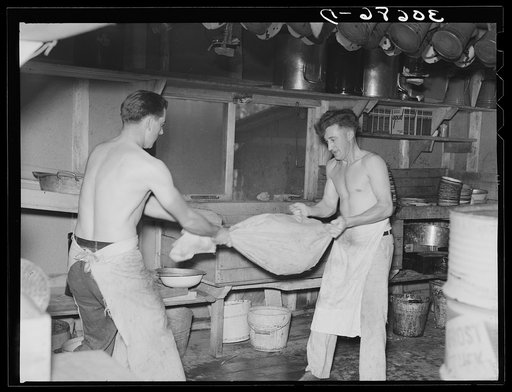 Cooks drying "silverware" in logging camp near Effie, Minnesota
